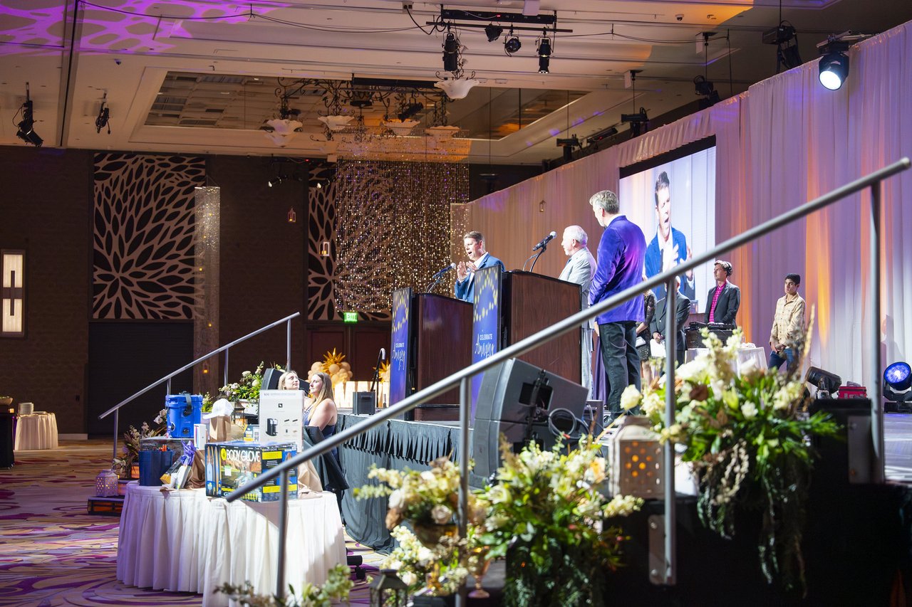 The stage and prize table seen from the side of the ballroom