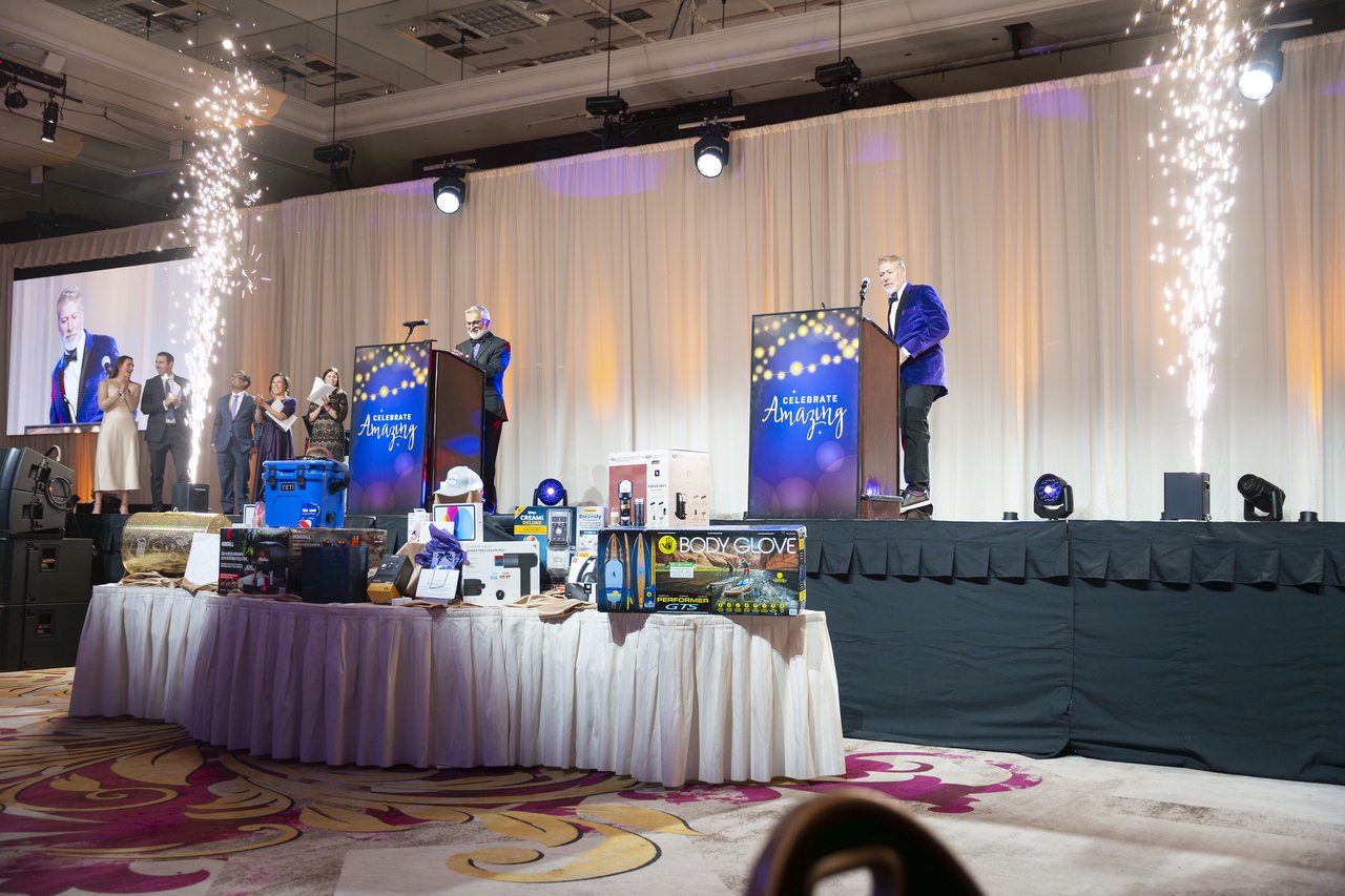 The stage and prize table with cold spark fountains on both sides