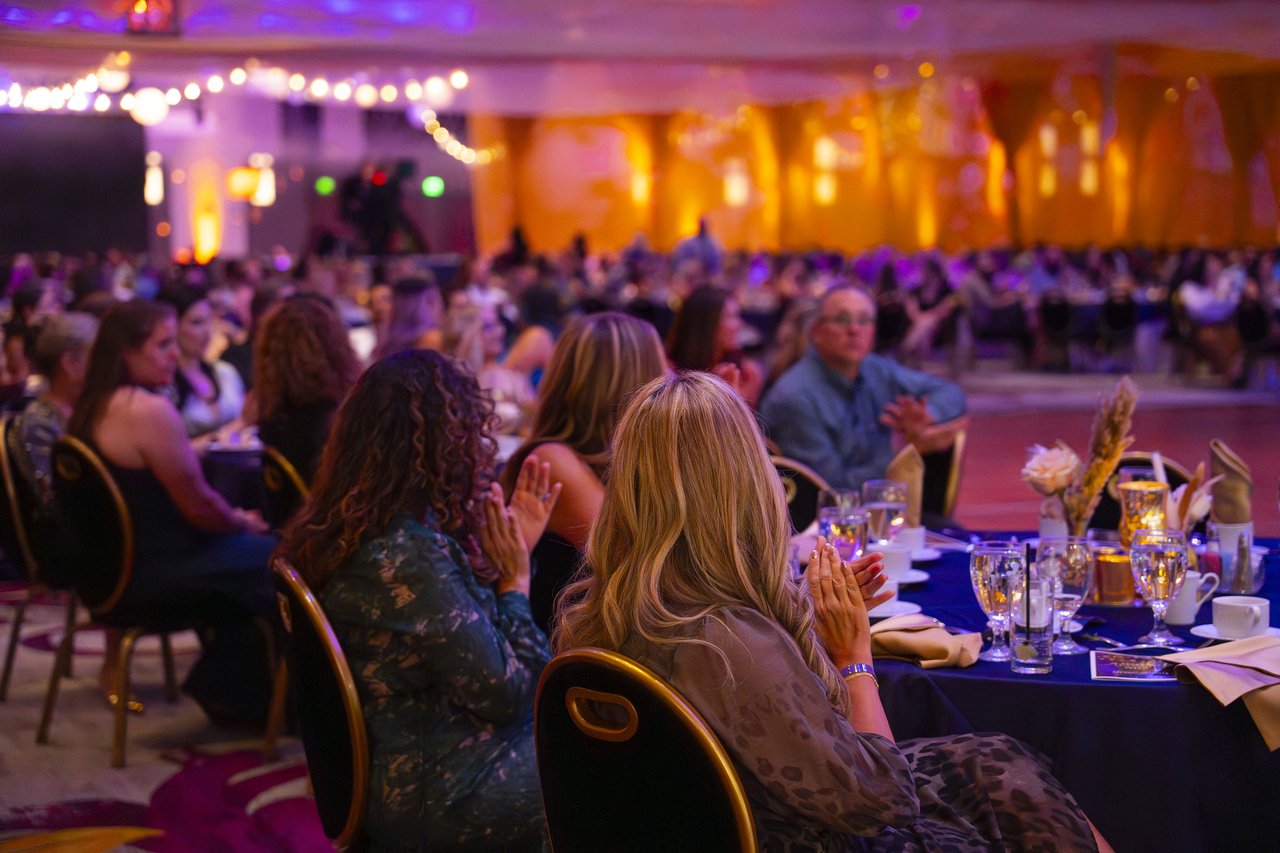 Renown guests clapping along from their tables