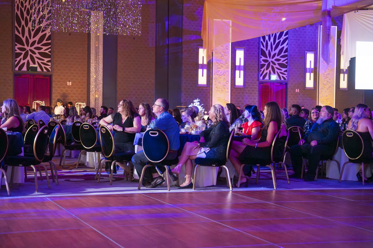 Renown tables watching the stage from the dance floor edge