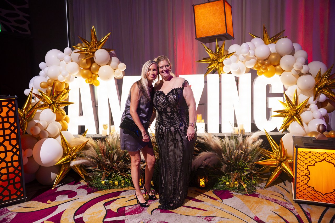 Two Renown friends posing at the Amazing letters