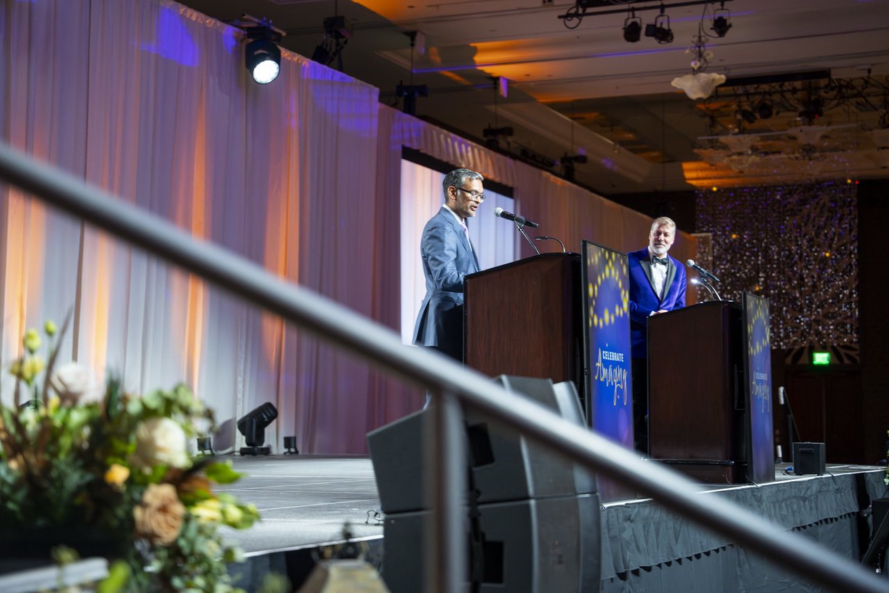 Two speakers at the twin podiums on stage