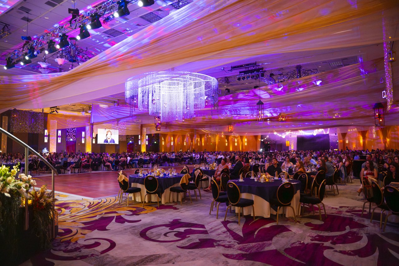 The wide ballroom under the crystal chandelier