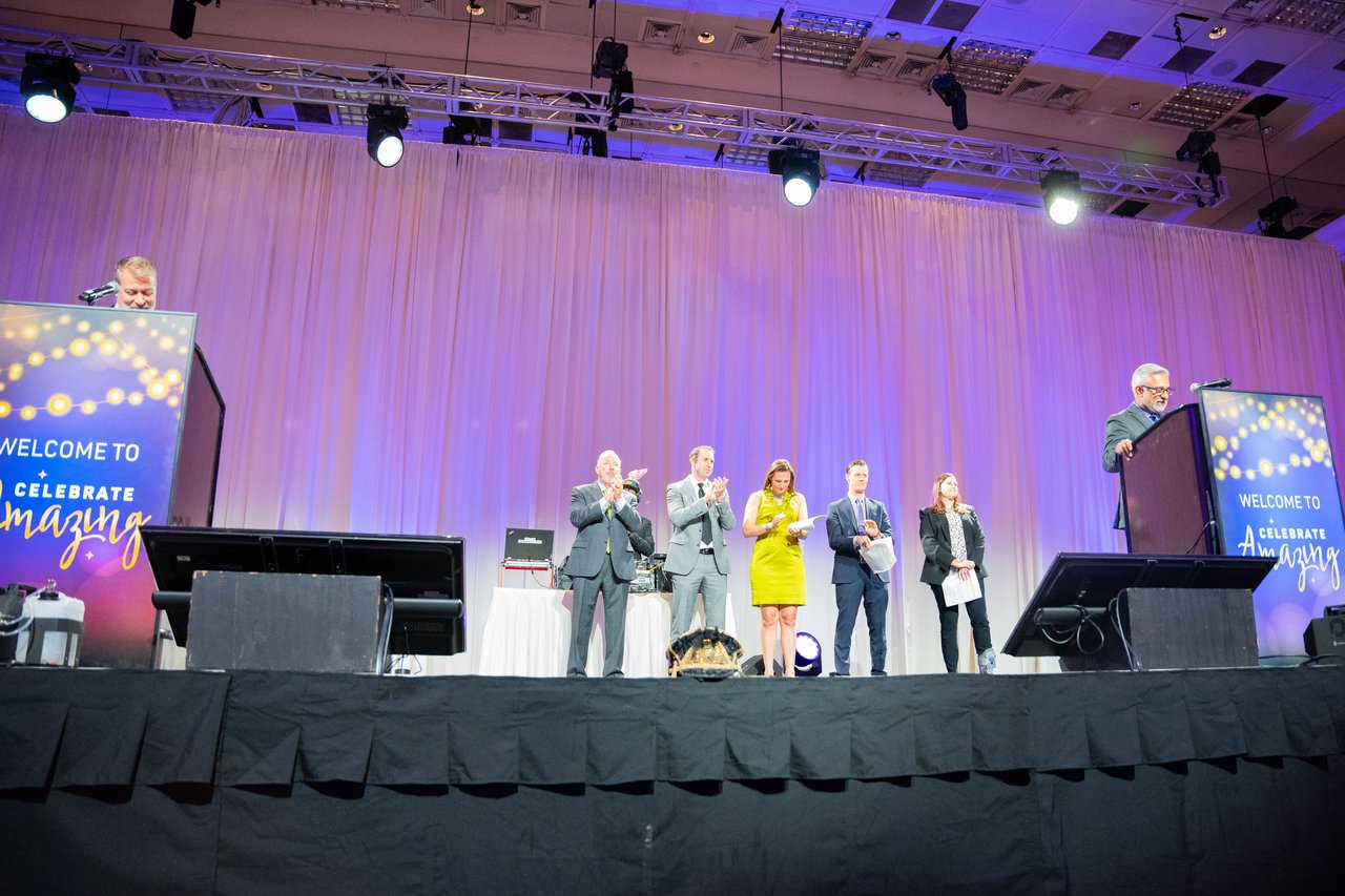 Wide view of the stage with Renown honorees and two podiums