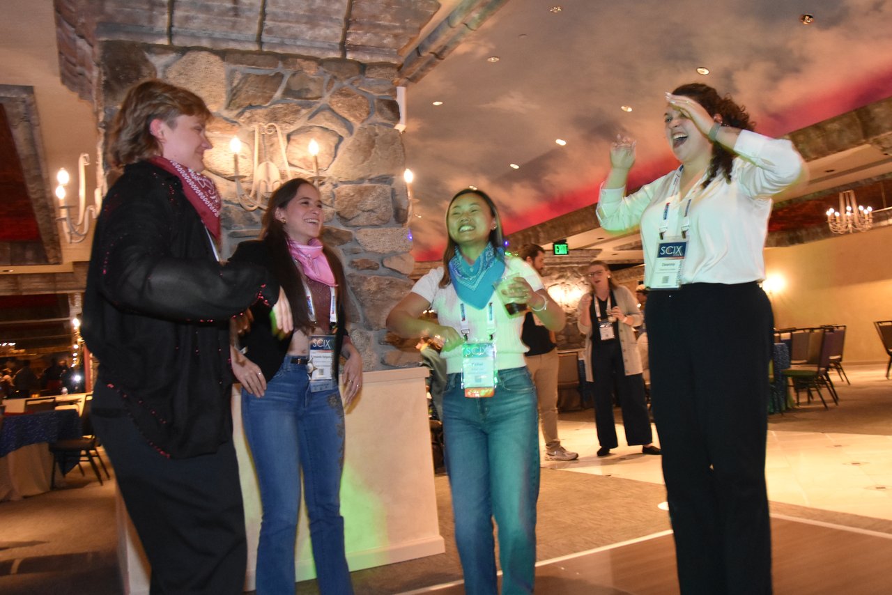 Guests dancing near the stone pillars at the SciX Gala