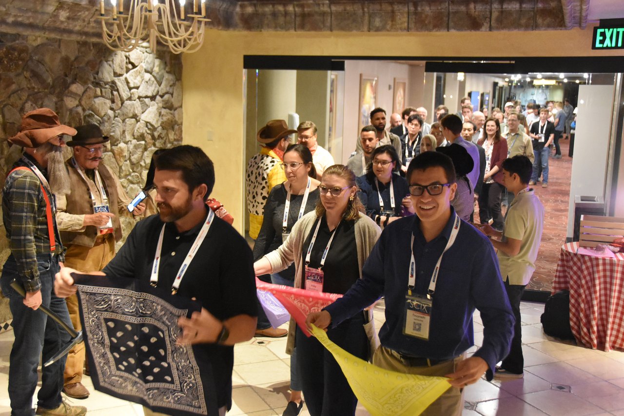 SciX Gala guests unfolding their new bandanas at the entrance