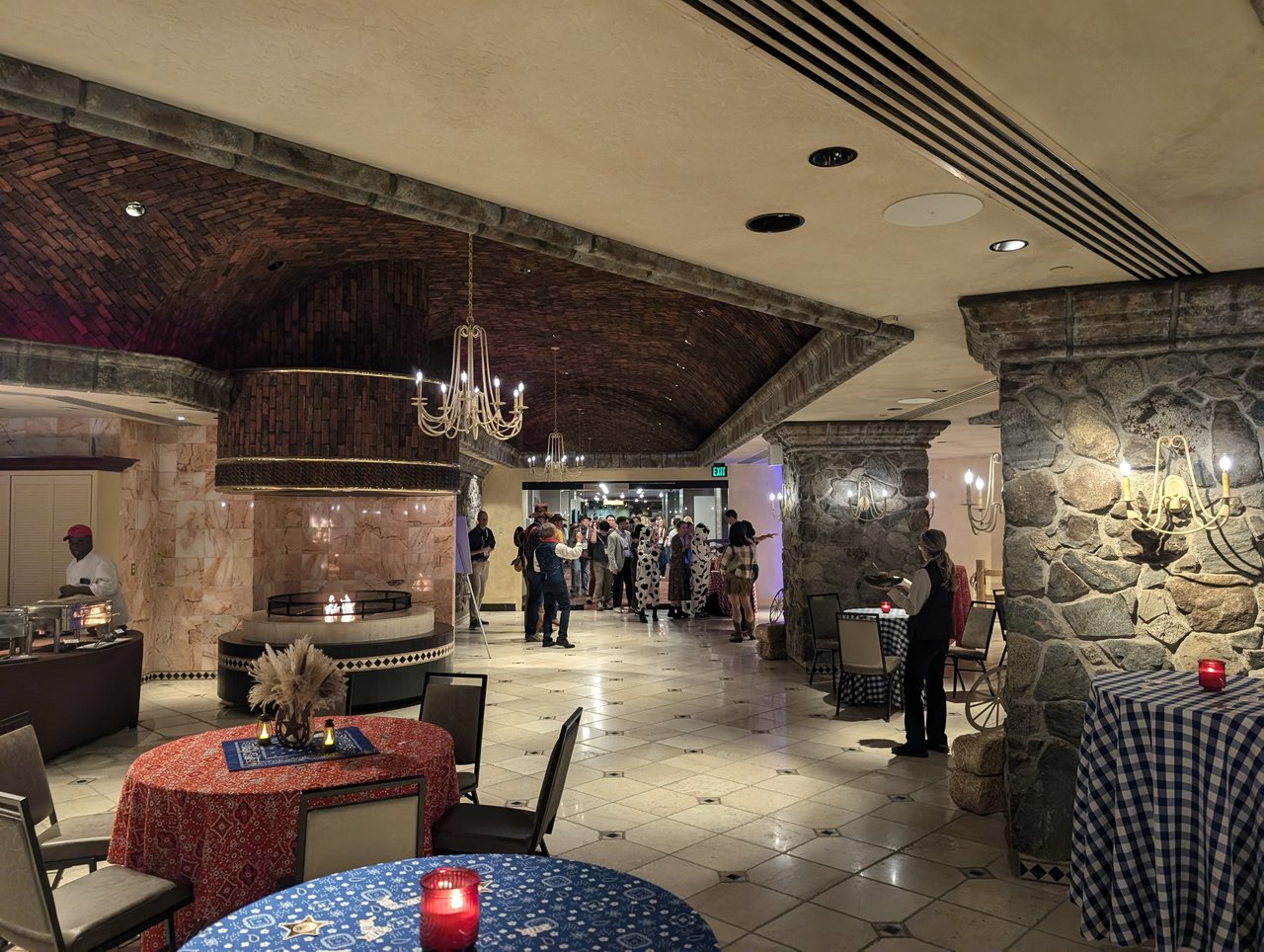 The Nugget foyer with a food station and bandana covered tables before the SciX Gala