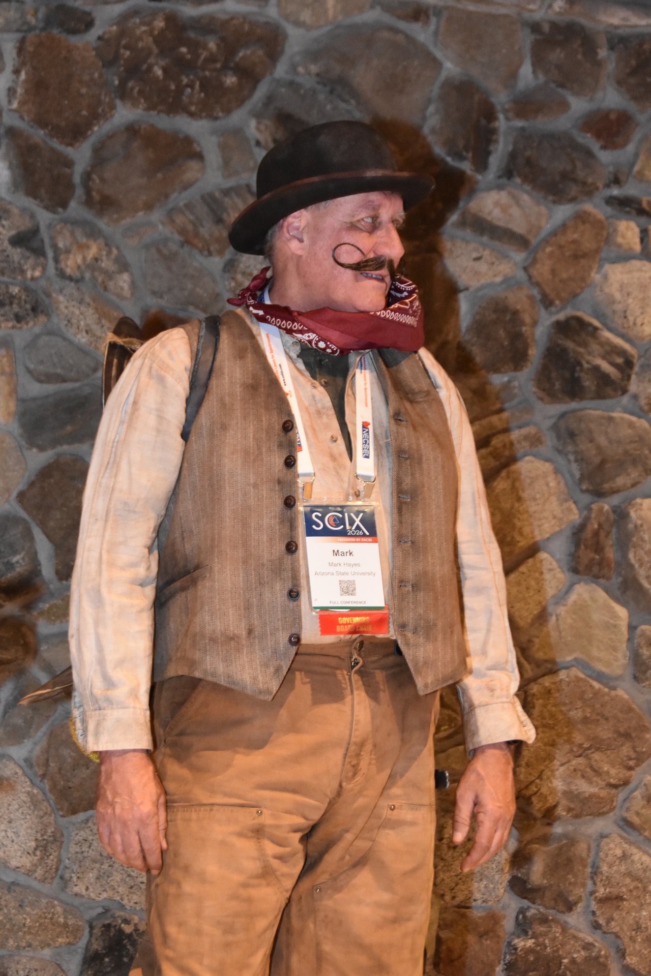 A SciX Gala guest in a full prospector costume with a curled mustache