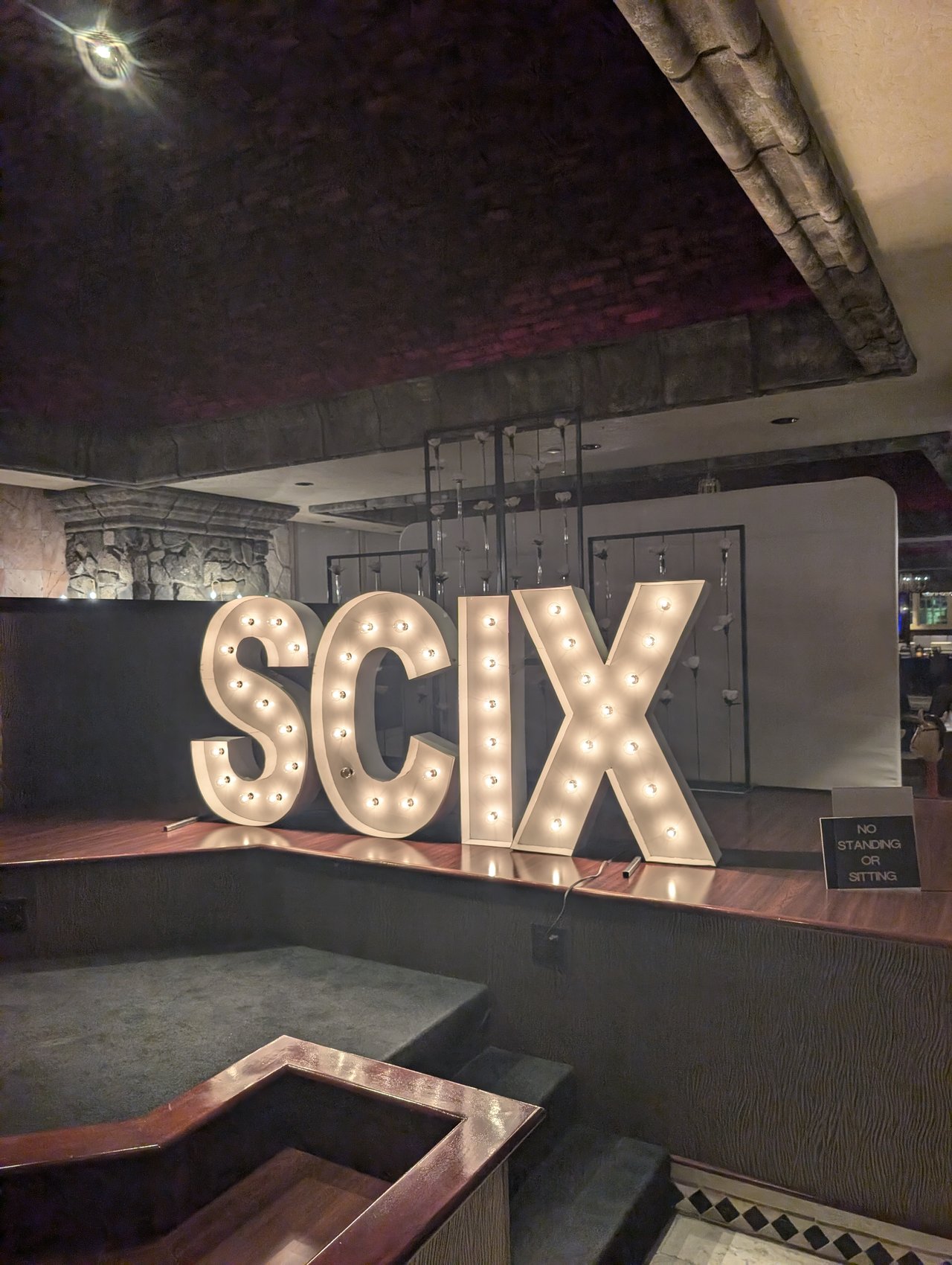 Lit SCIX marquee letters on the stage at the Nugget Casino Resort