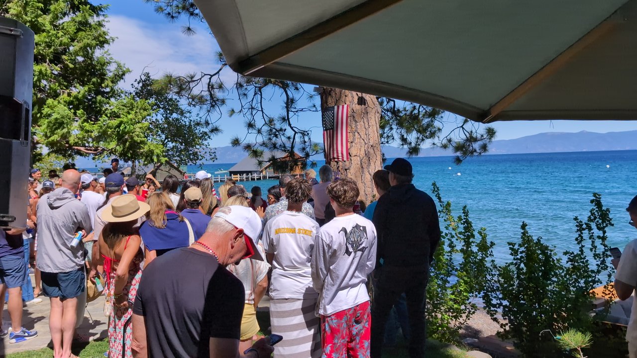 Guests looking out over Lake Tahoe from the lawn