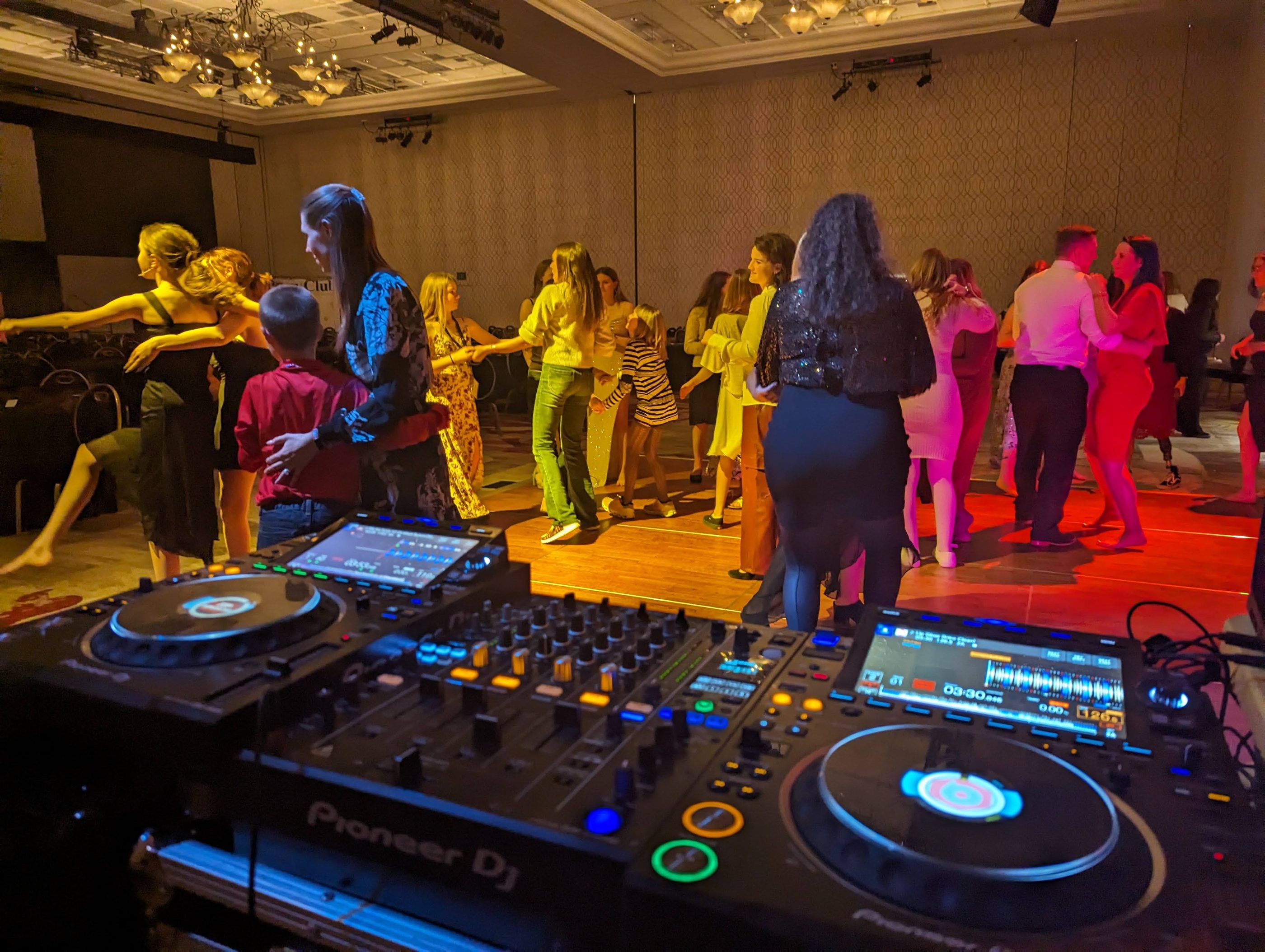 The Pioneer DJ decks in front of a full dance floor at the United States Pony Clubs Convention banquet at the Peppermill