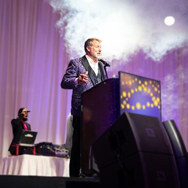 A large corporate event in the Peppermill Tuscany Ballroom with professional Reno DJ lighting and sound.