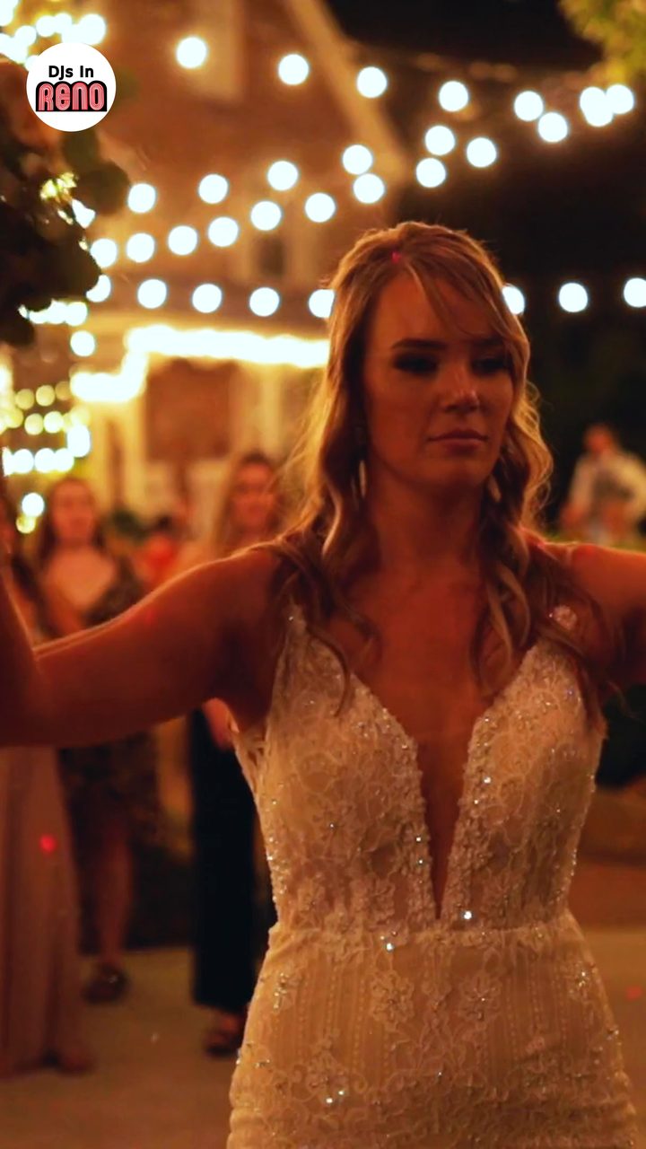 Joan dancing with her arms up among her guests at her wedding, the first frame of the DJs In Reno sizzle reel