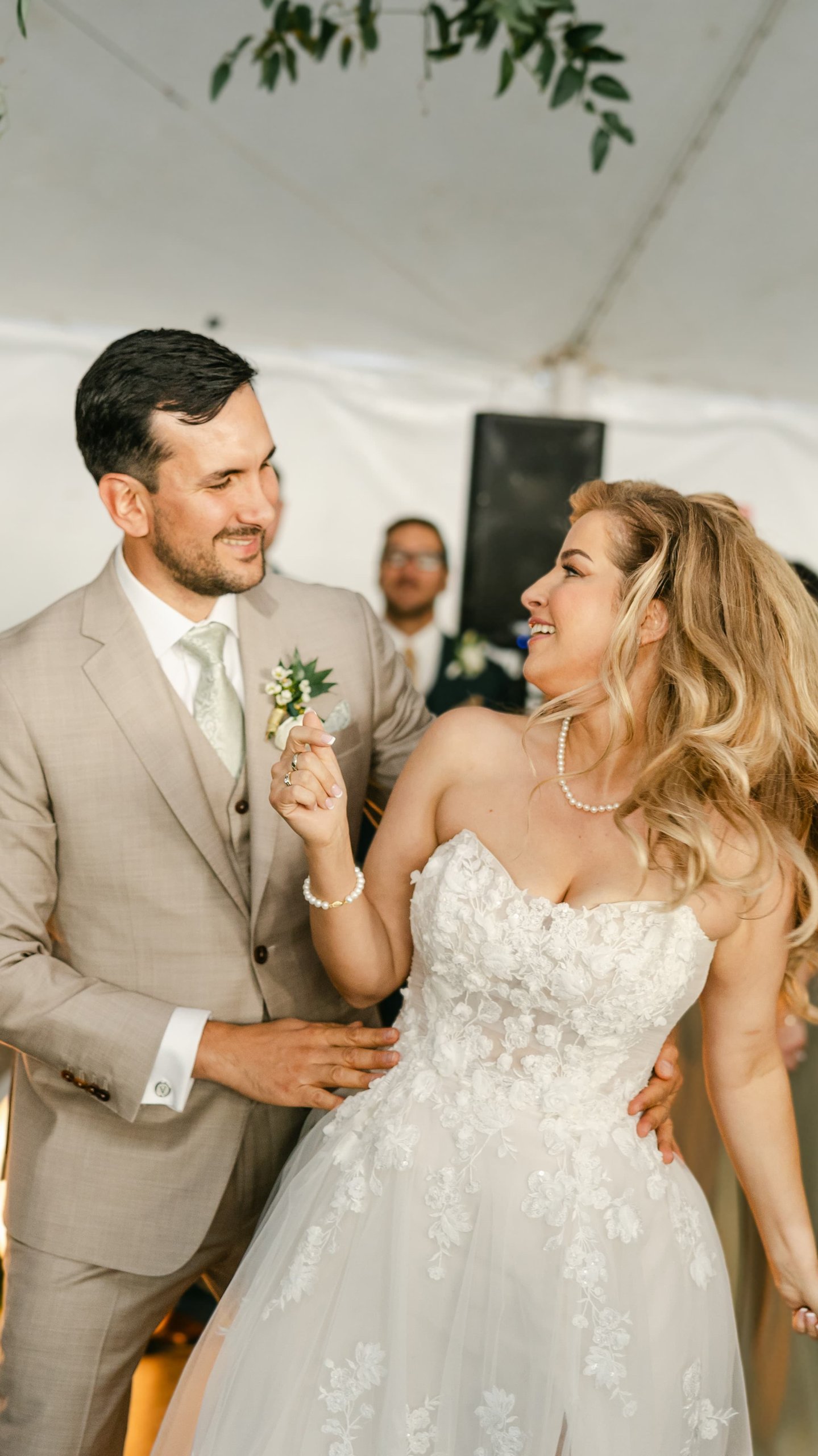 Britt and Chris dance in front of marquee letters at The Club at Rancharrah