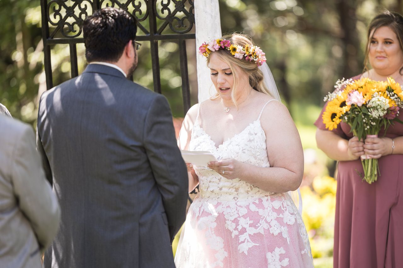 Abney reads her vows to Chris at the arbor