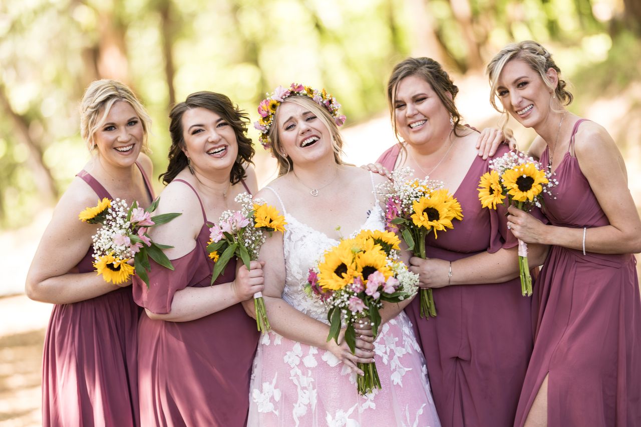 Abney laughs with her bridesmaids leaning in close around her