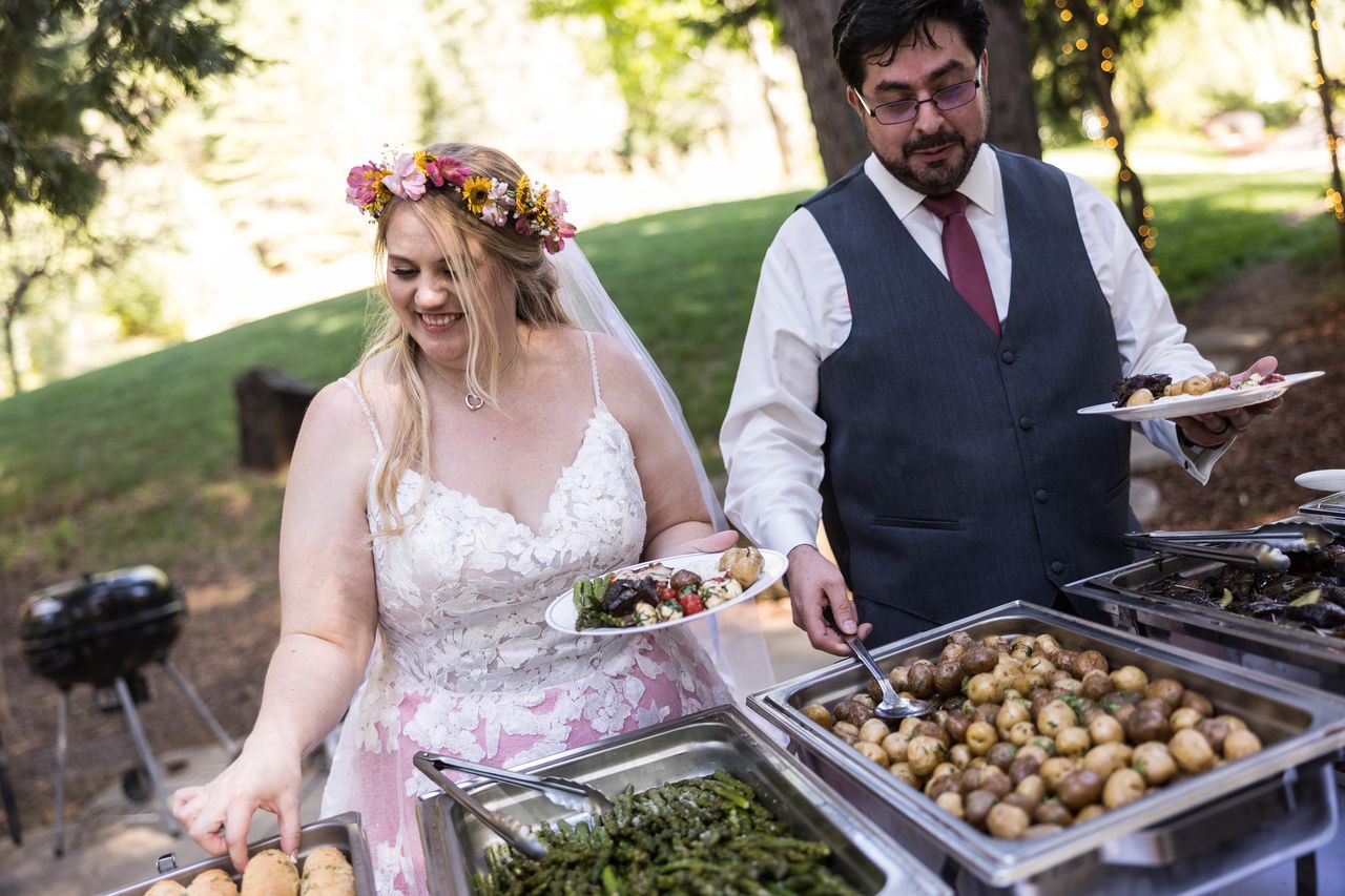 Abney and Chris serve themselves at the buffet