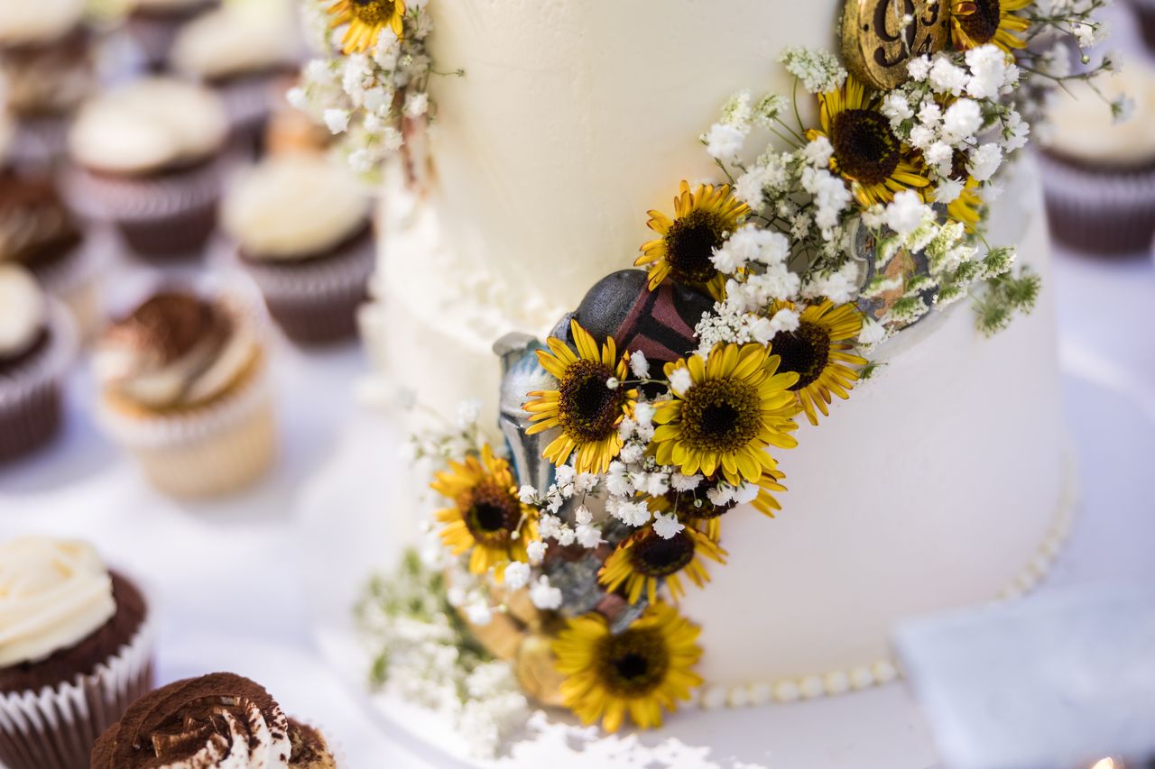 Sunflowers and baby's breath trailing down the side of the wedding cake