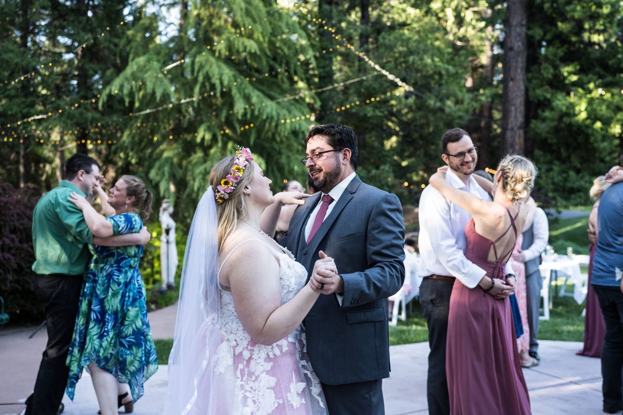 Abney and Chris dance on the patio surrounded by other couples