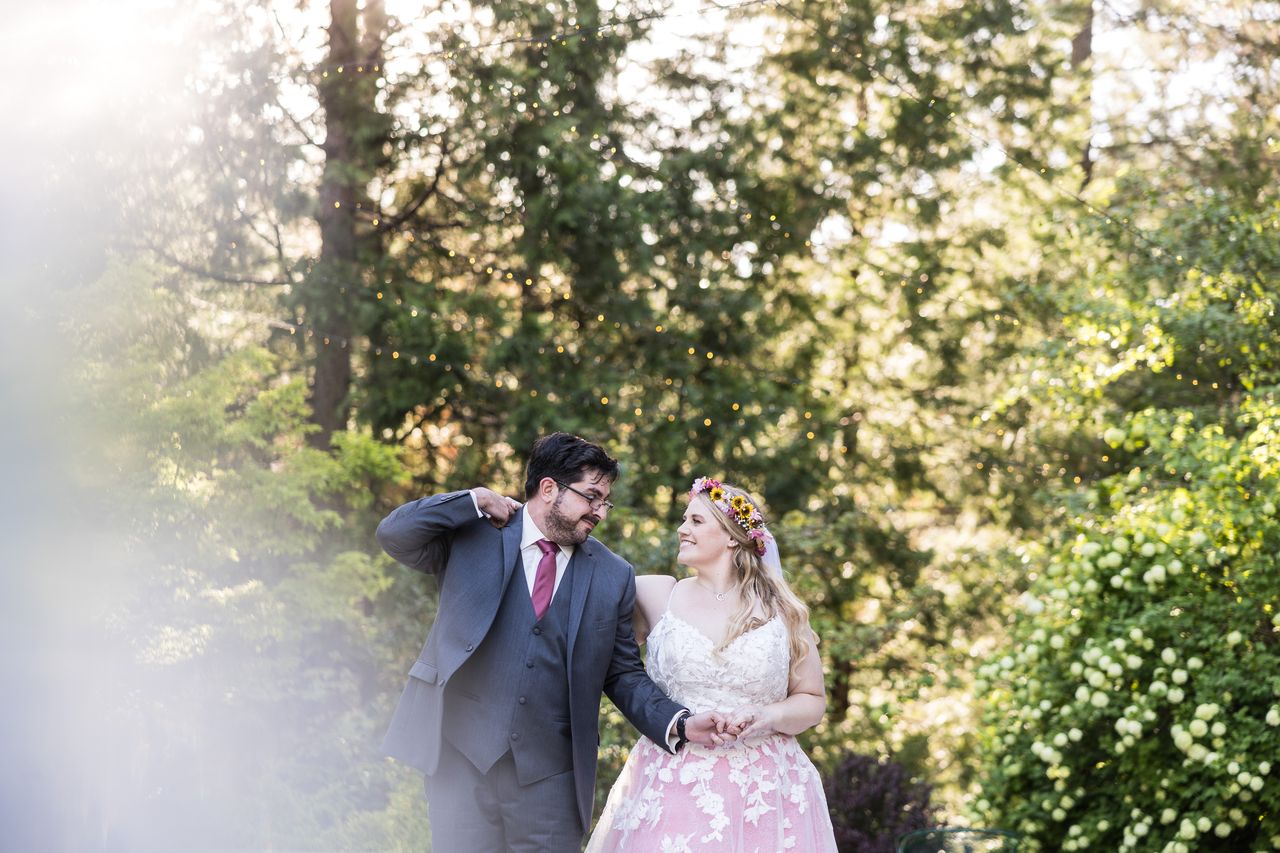 Abney and Chris dance together in the warm evening light
