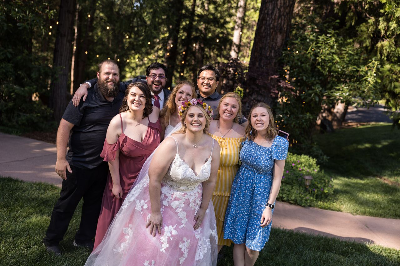 Abney poses with a group of friends on the lawn