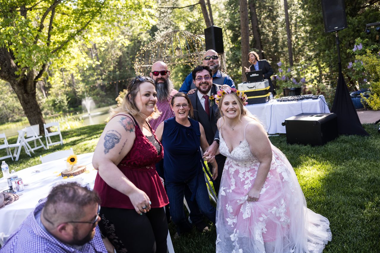 Abney and Chris pose with a table of friends during the photo rush
