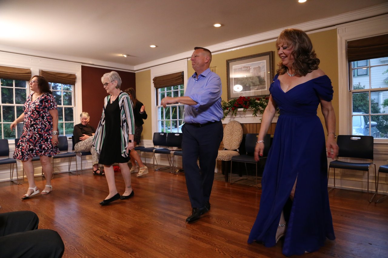 Alexanne dances with guests as the evening goes on