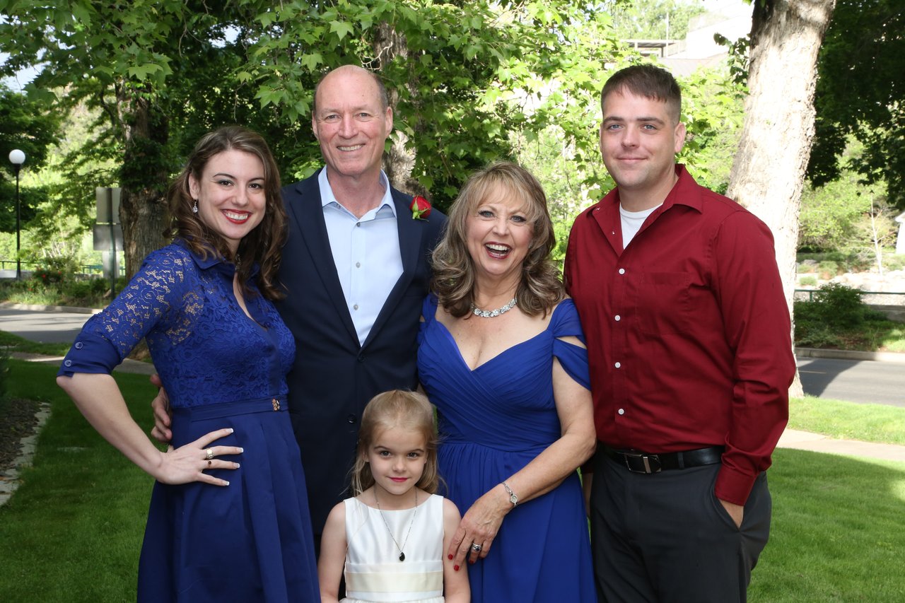Alexanne and Tim with their family on the lawn