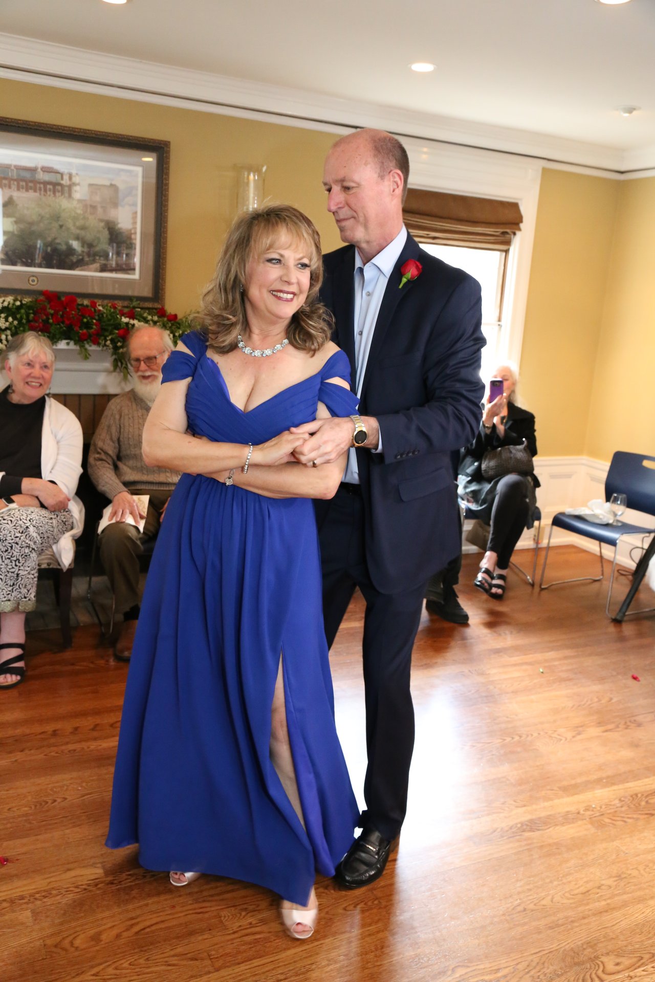 Alexanne and Tim begin their first dance as guests watch