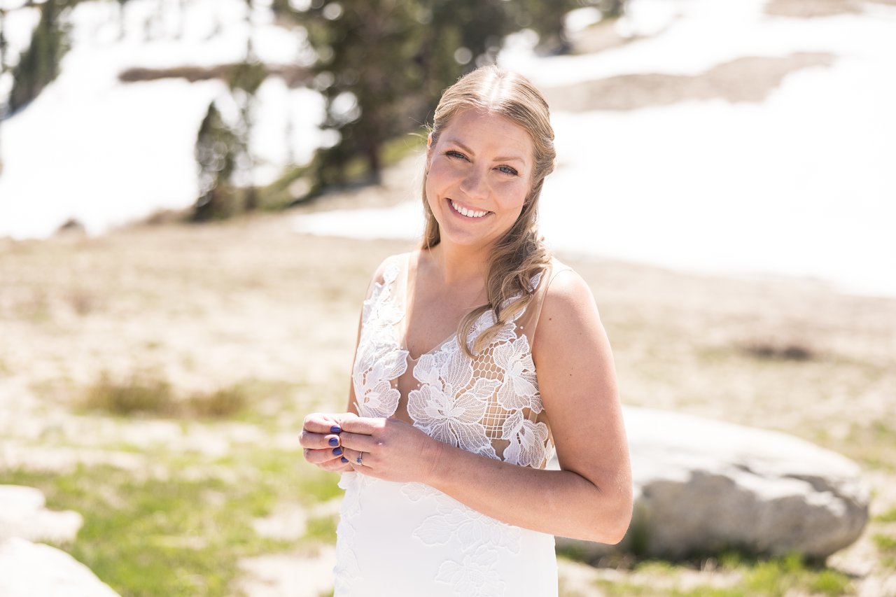Ali smiling in a snowy meadow