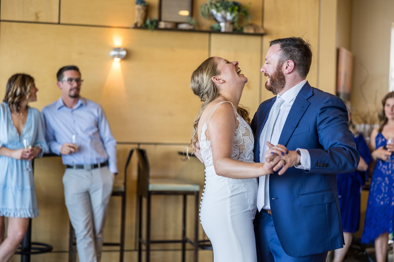 Ali laughs with her head back during the dance