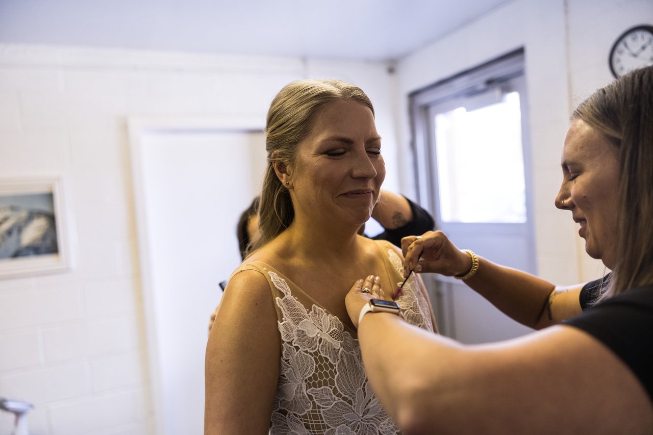 Ali laughs with her makeup artist