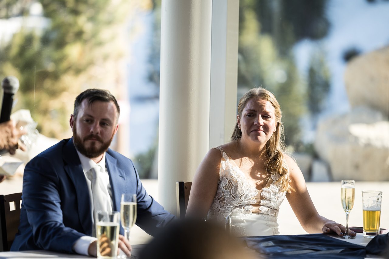 Ali and Robert listen to a toast