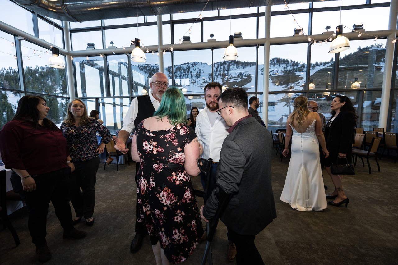Guests dancing with the snowy slopes outside