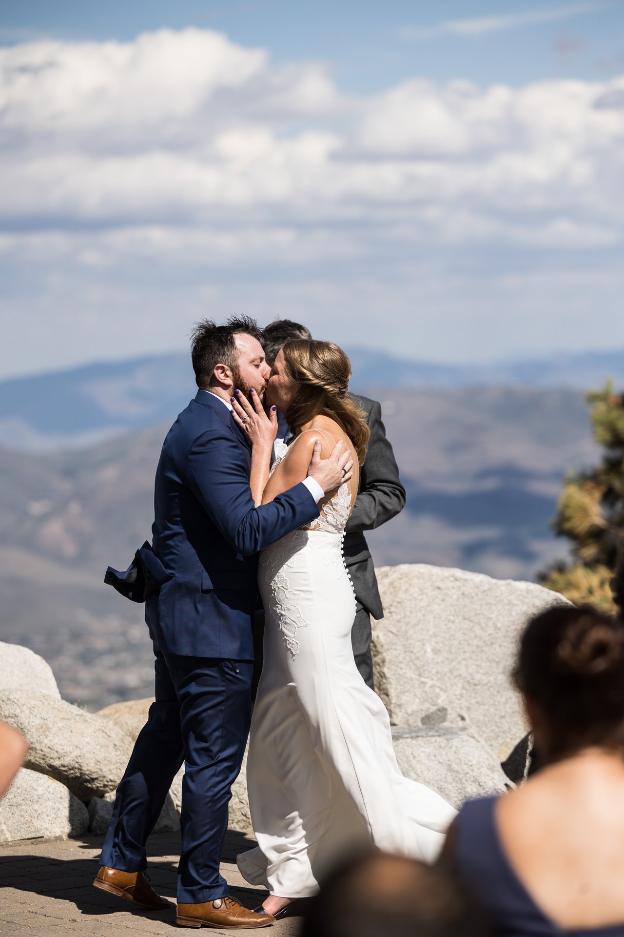 Their first kiss as husband and wife with the valley behind them