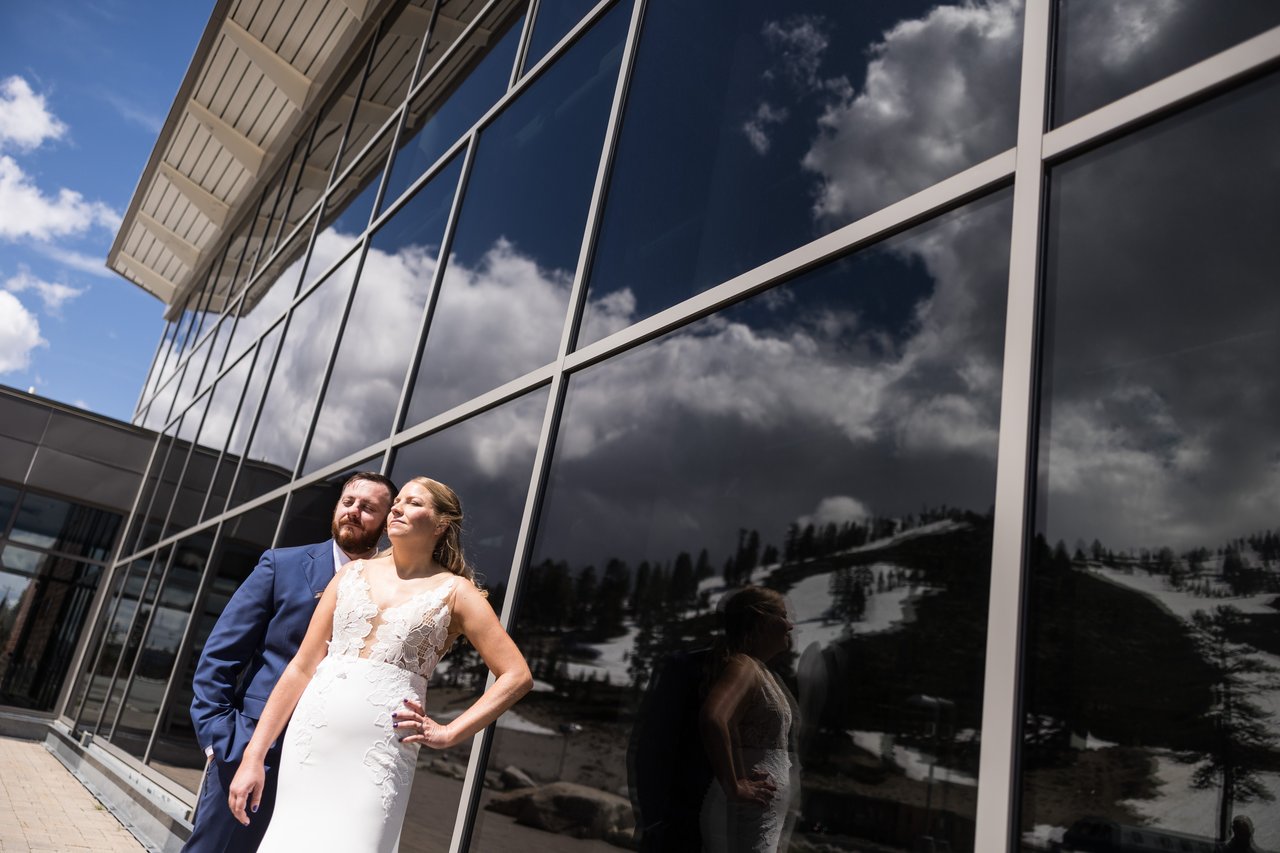 Ali and Robert reflected in the glass with the snowy mountain