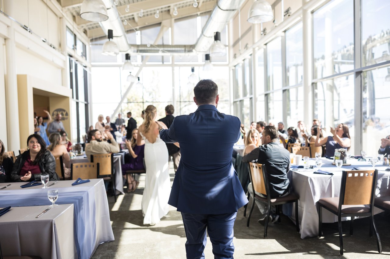 Ali and Robert make their grand entrance through the tables