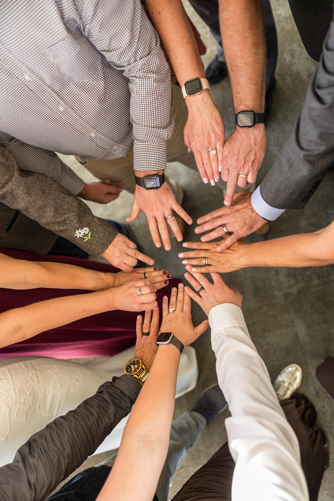 Hands in a circle with the rings