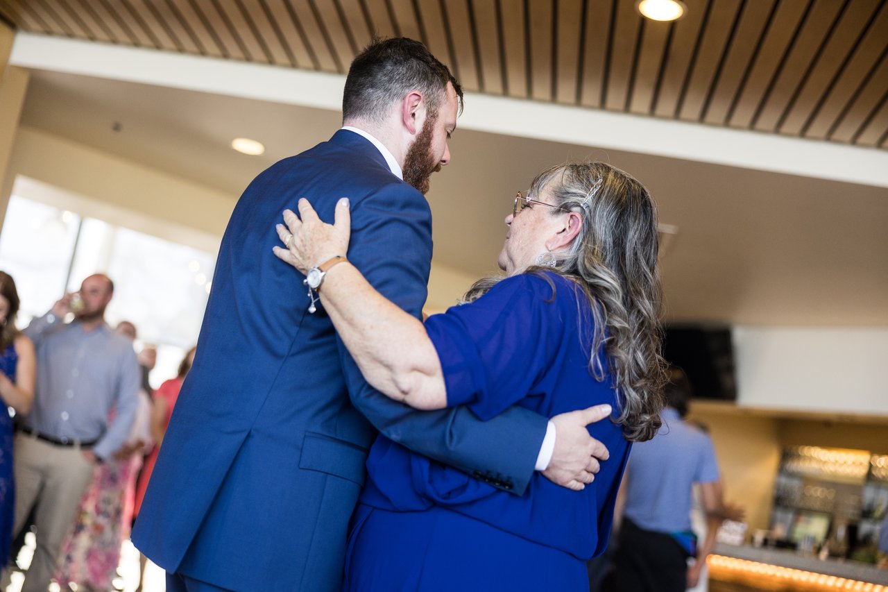 Robert hugs his mom during their dance
