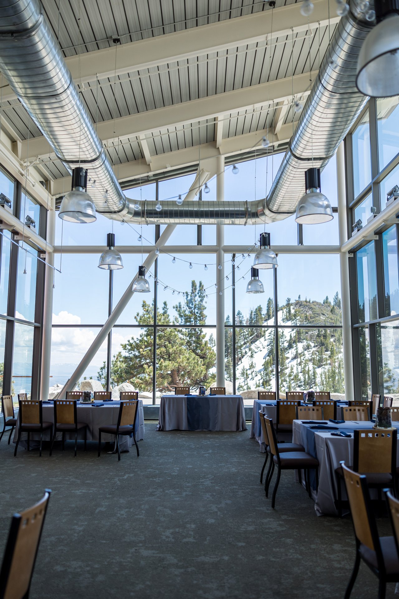 The glass reception hall set for dinner