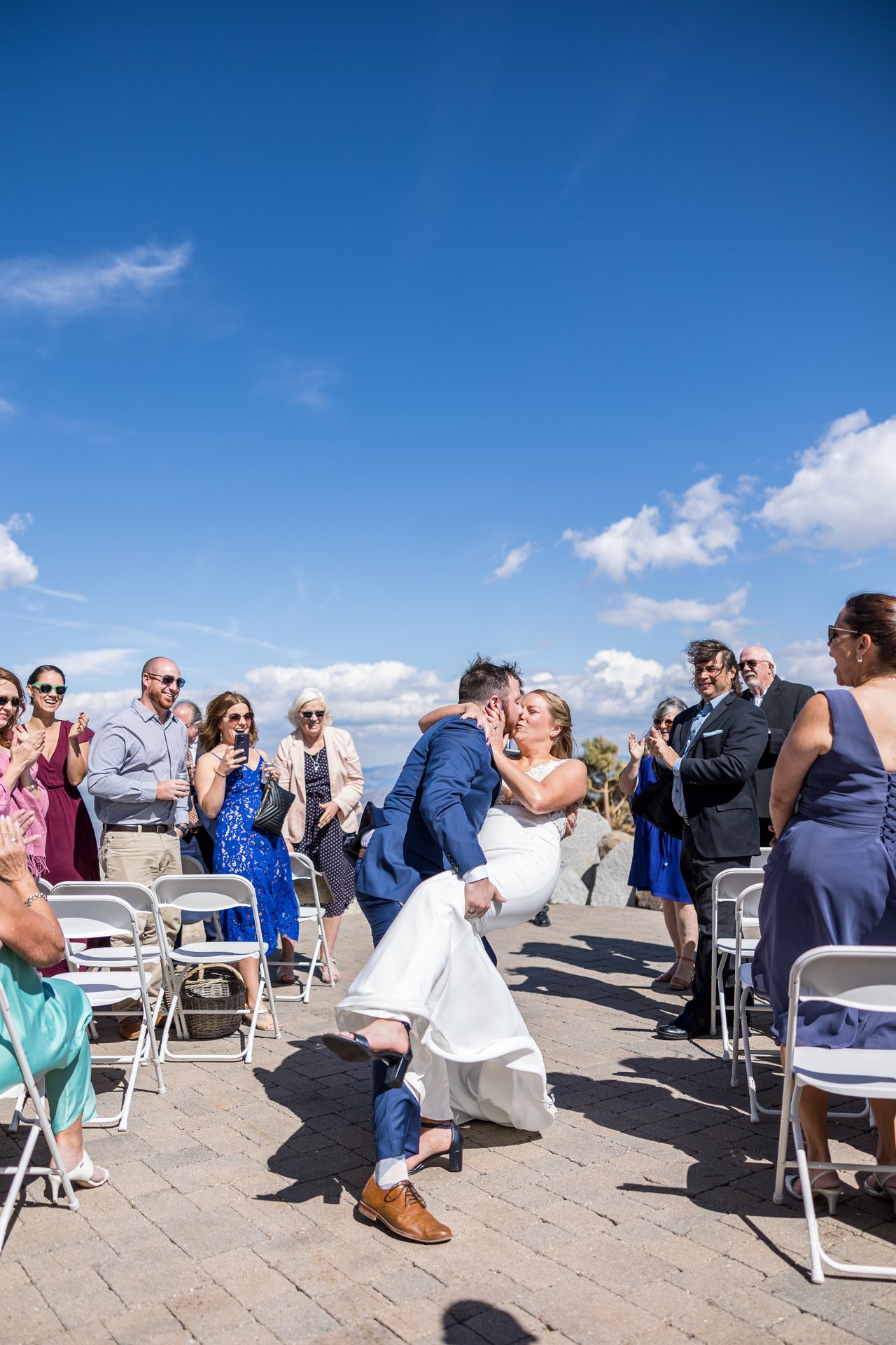 A dip kiss in the aisle on the way out