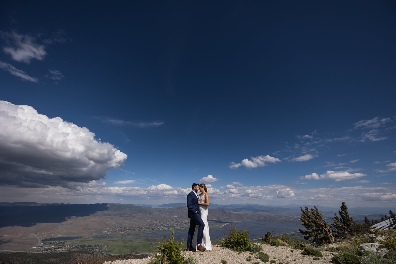 Ali and Robert on the ridge under a deep blue sky