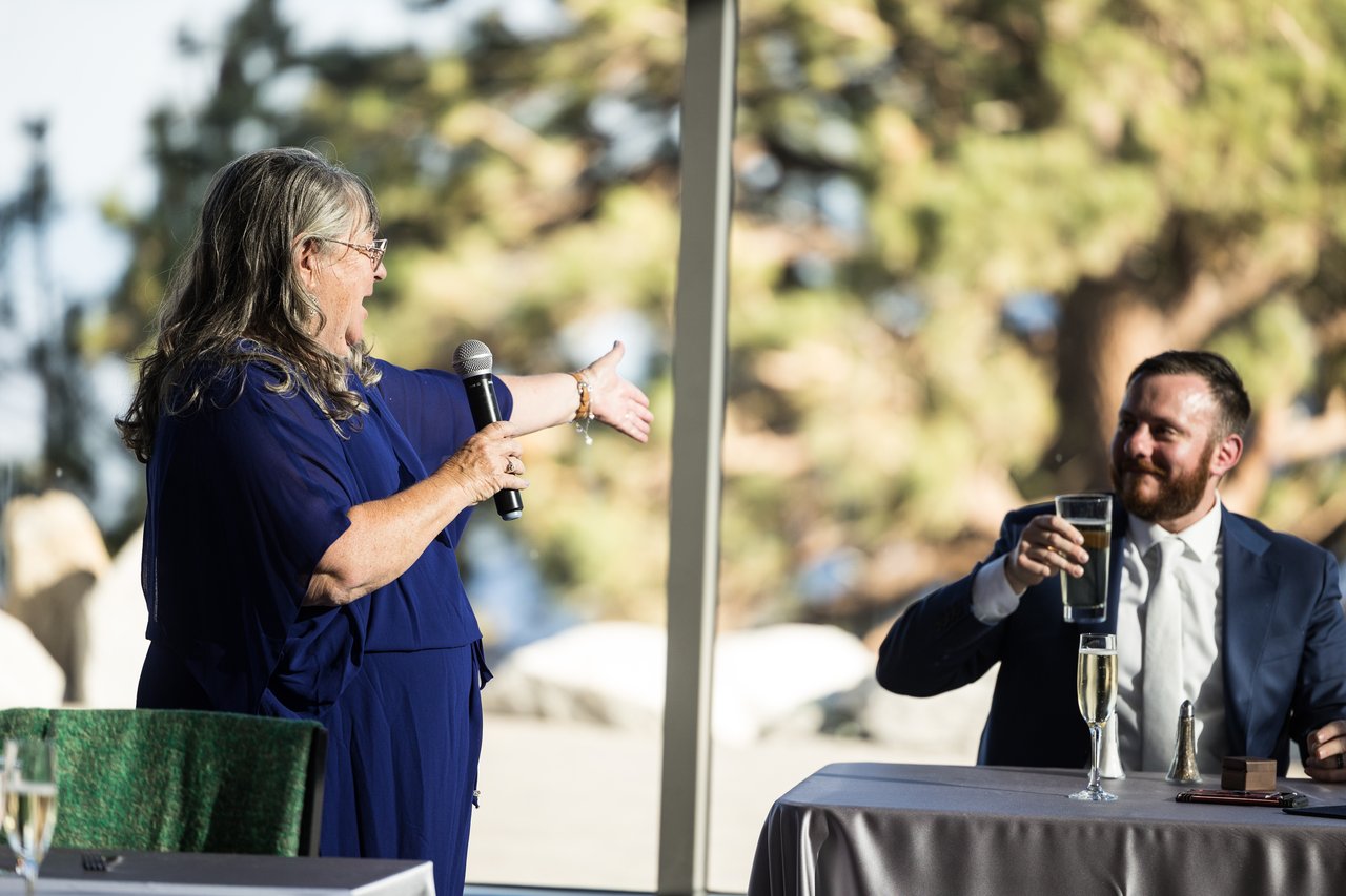 Robert raises his glass during the toasts