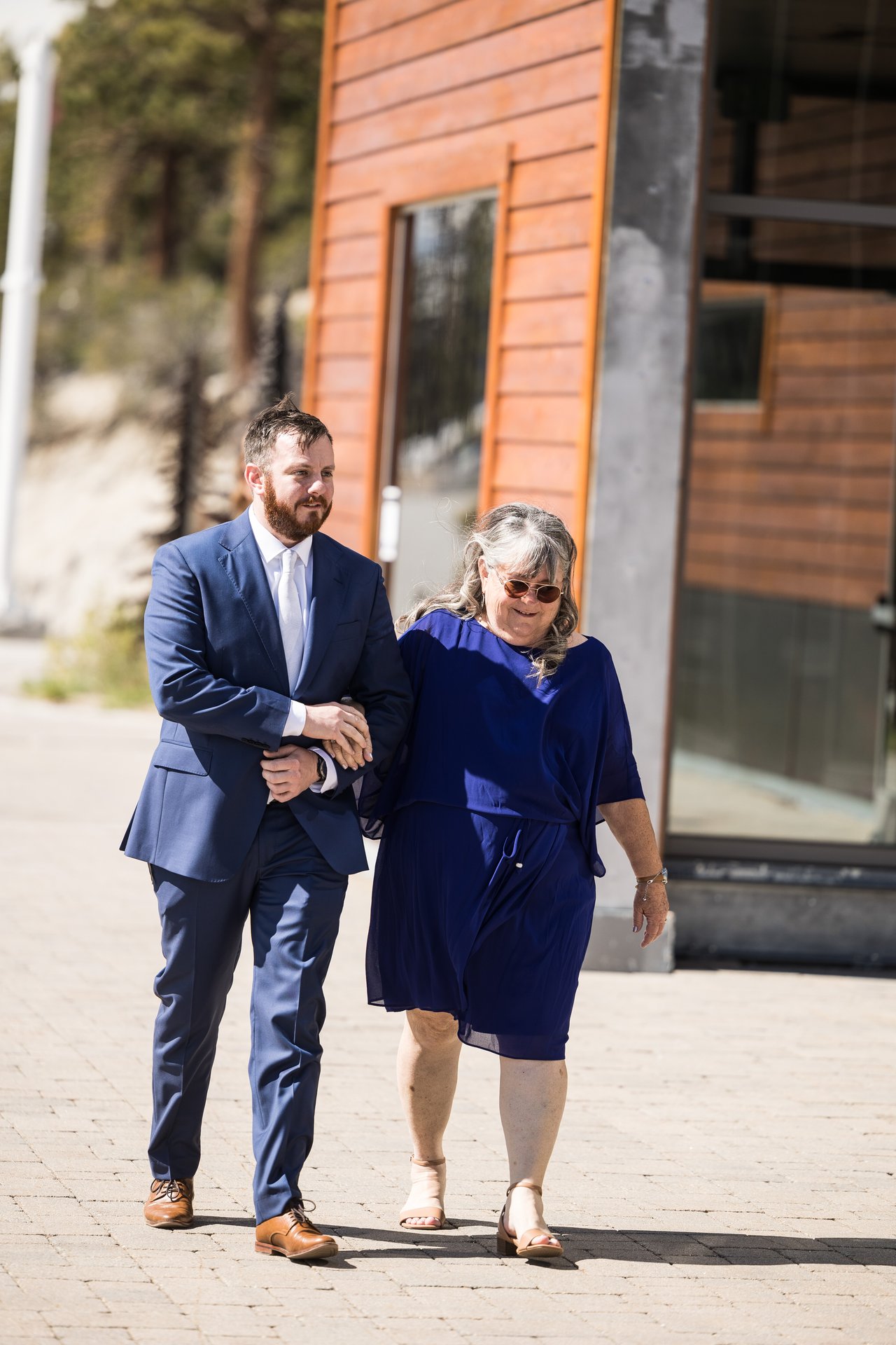 Robert walks his mom down the aisle