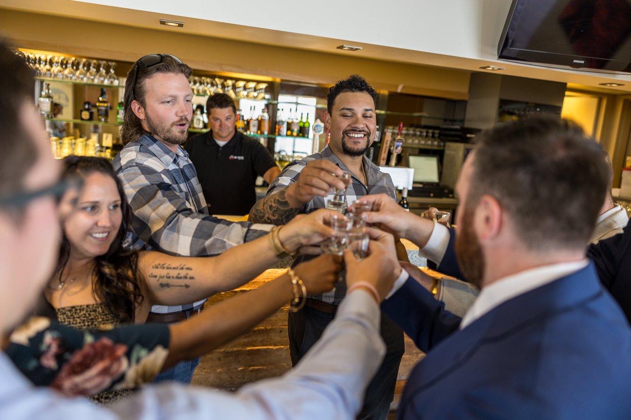 Robert and friends take a shot at the bar