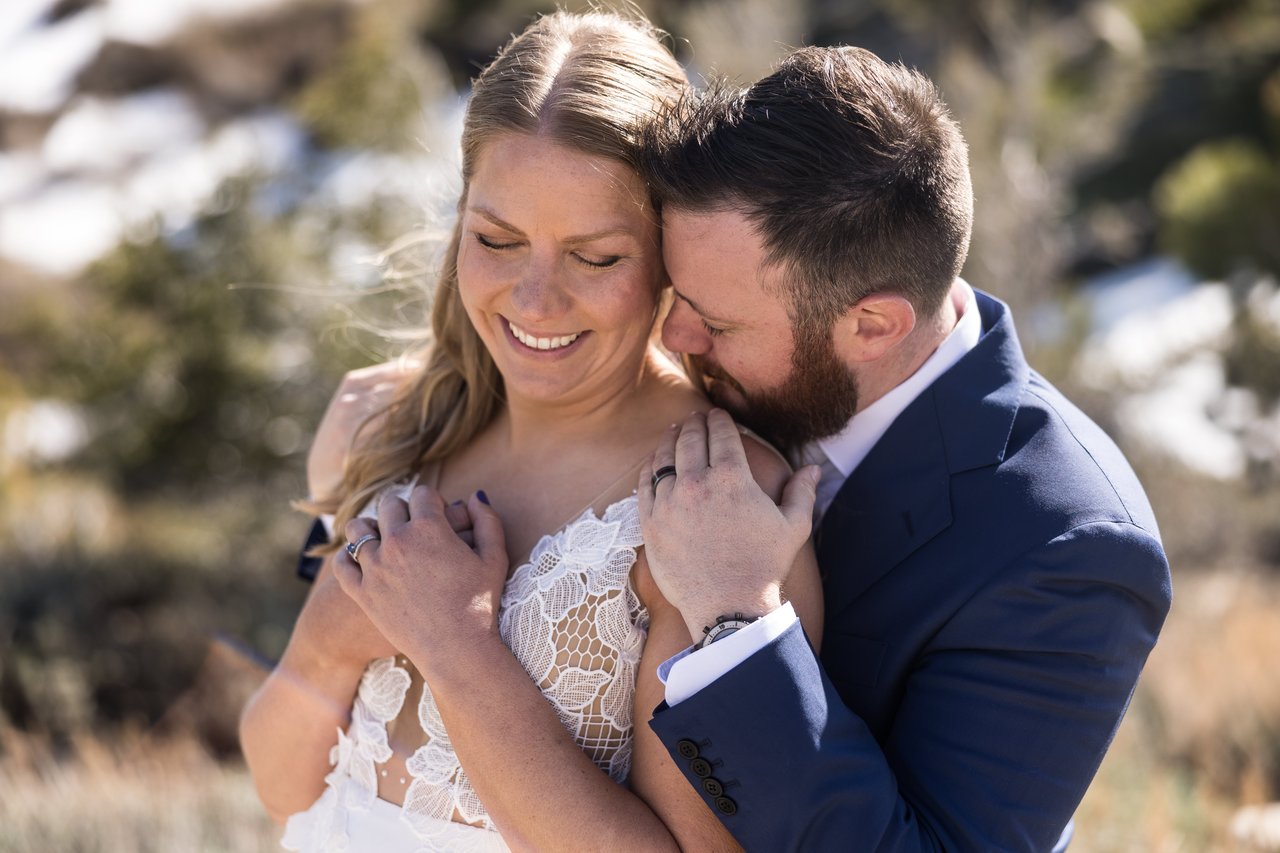 A tight embrace with snow soft behind them