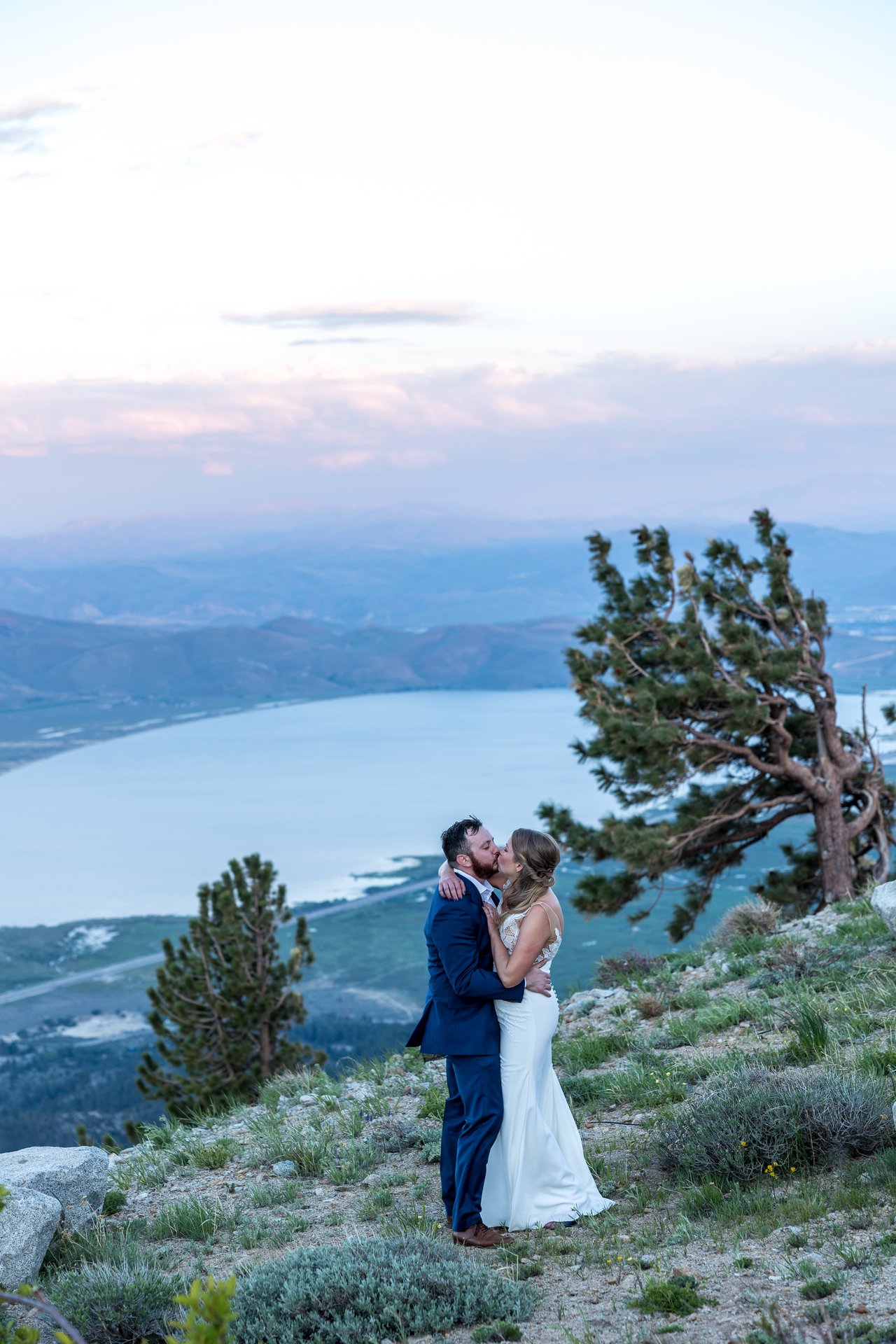 Ali and Robert beside the windswept pine at sunset