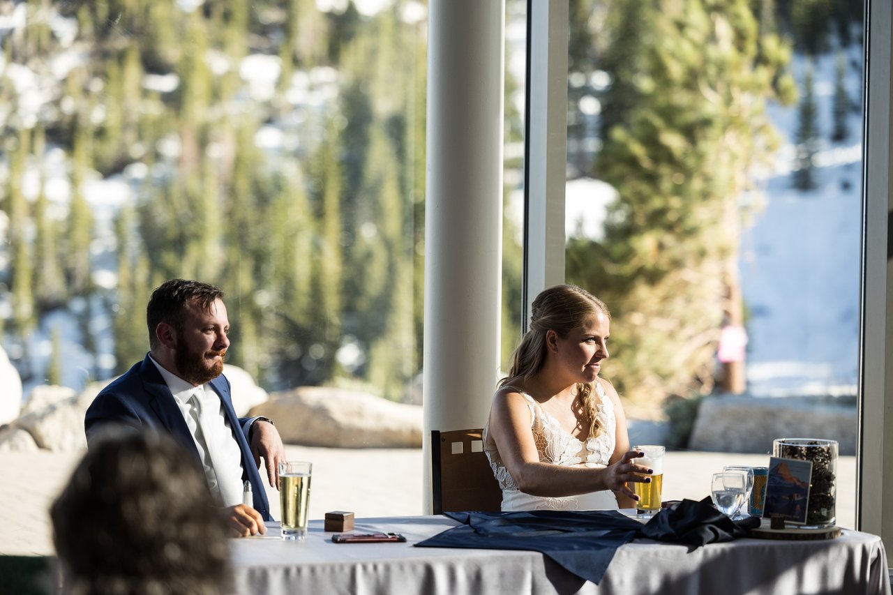 The sweetheart table with the snowy hill behind