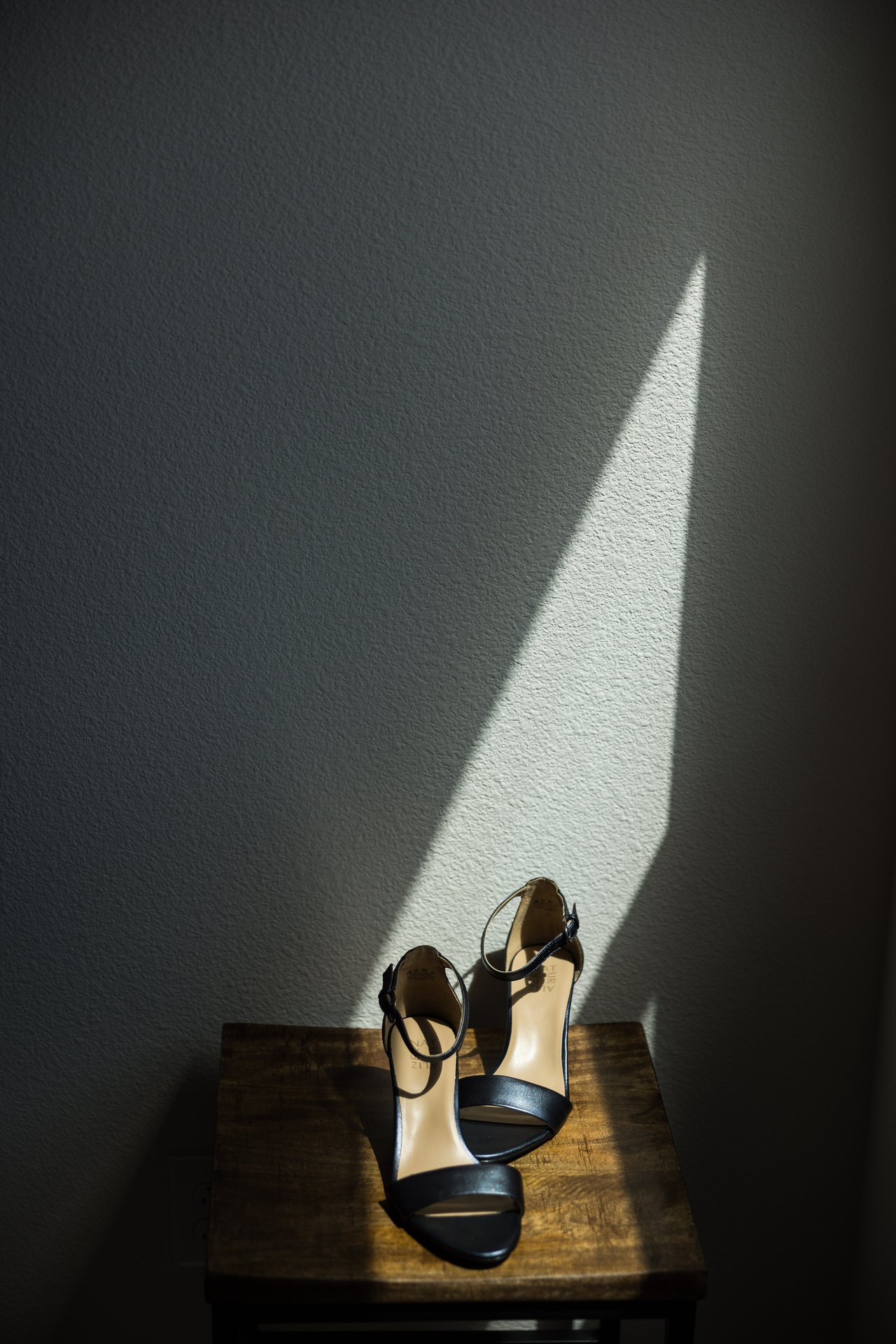 Ali's wedding shoes set out on a table
