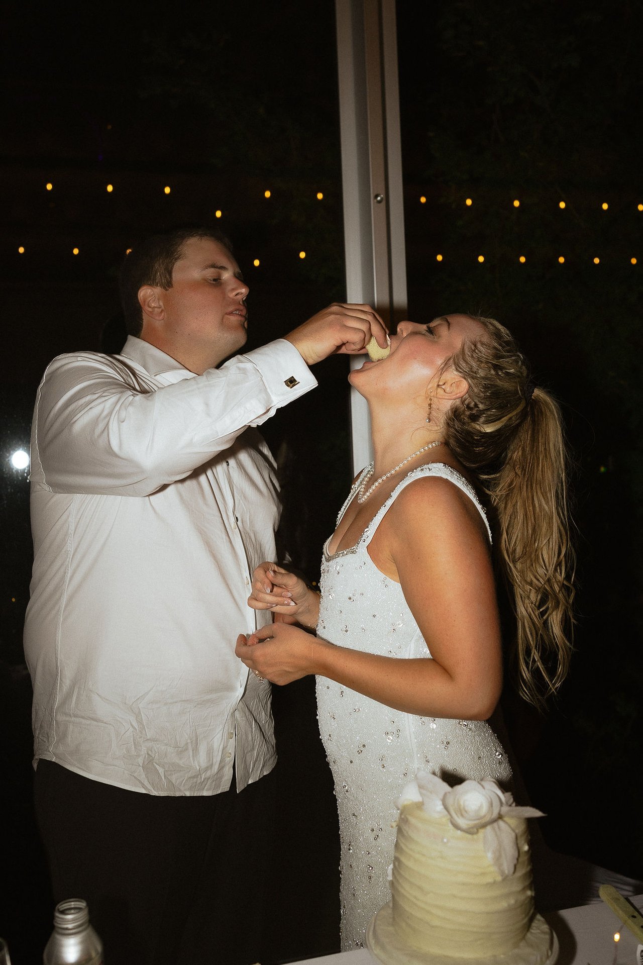 Ally and Drew feed each other cake